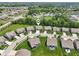 Picturesque aerial view of a suburban neighborhood with green spaces, mature trees, and well-maintained homes at 18998 Beverly Shones Ln, Noblesville, IN 46062