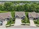 Aerial view of a charming suburban street with well-maintained homes, mature trees, and landscaped yards at 18998 Beverly Shones Ln, Noblesville, IN 46062