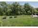 Beautiful, spacious backyard with a black fence, and lush green trees surrounding the property at 18998 Beverly Shones Ln, Noblesville, IN 46062