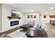 Basement living room with wood floors, fireplace, TV, and furnishings at 18998 Beverly Shones Ln, Noblesville, IN 46062