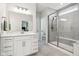 Bathroom featuring white cabinets, quartz countertops, tile flooring, and glass enclosed shower at 18998 Beverly Shones Ln, Noblesville, IN 46062