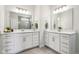 Bright bathroom featuring double sinks, white cabinets, quartz countertops, and tile flooring at 18998 Beverly Shones Ln, Noblesville, IN 46062