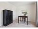 Bedroom features neutral tones, carpet floors, a desk and chair set, plus a black cabinet with drawers for storage at 18998 Beverly Shones Ln, Noblesville, IN 46062