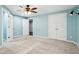 Well-lit bedroom with large closet space, ceiling fan, and light blue walls at 18998 Beverly Shones Ln, Noblesville, IN 46062
