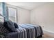 This comfortable bedroom is illuminated by a window with stylish curtains at 18998 Beverly Shones Ln, Noblesville, IN 46062