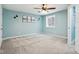 Light and airy bedroom with gray carpeting, updated lighting, and a view from the window at 18998 Beverly Shones Ln, Noblesville, IN 46062