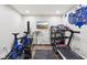 Basement exercise room featuring wood floors, treadmill, and bike at 18998 Beverly Shones Ln, Noblesville, IN 46062