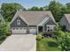 Charming home featuring a three-car garage and well-manicured landscaping at 18998 Beverly Shones Ln, Noblesville, IN 46062