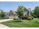 Charming home featuring a beautifully landscaped front yard and a spacious three-car garage at 18998 Beverly Shones Ln, Noblesville, IN 46062