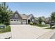 Lovely home featuring a spacious driveway, three-car garage, and well-maintained lawn at 18998 Beverly Shones Ln, Noblesville, IN 46062
