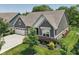 A view of the property showcasing lush greenery and a well-maintained lawn at 18998 Beverly Shones Ln, Noblesville, IN 46062