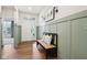 Light and airy foyer with wainscoting, hardwood floors, and bench seating at 18998 Beverly Shones Ln, Noblesville, IN 46062