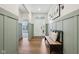 Light and airy foyer with wainscoting, hardwood floors, and bench seating at 18998 Beverly Shones Ln, Noblesville, IN 46062