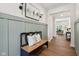 Foyer featuring paneled walls and hardwood floors; living spaces flow beyond at 18998 Beverly Shones Ln, Noblesville, IN 46062