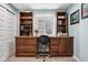 Inviting home office features custom built-ins and desk with natural light from the window at 18998 Beverly Shones Ln, Noblesville, IN 46062