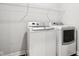Clean laundry room equipped with modern washer and dryer units at 18998 Beverly Shones Ln, Noblesville, IN 46062