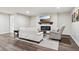 Basement living room featuring an electric fireplace and a large flat screen tv at 18998 Beverly Shones Ln, Noblesville, IN 46062