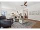 Comfortable living room showcasing an open layout to the kitchen, wood floors, and neutral decor at 18998 Beverly Shones Ln, Noblesville, IN 46062