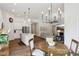 Open-concept living space with a seamless flow from the dining area to the living room at 18998 Beverly Shones Ln, Noblesville, IN 46062