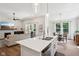 Open-concept living space showcases the kitchen, living room, and dining area at 18998 Beverly Shones Ln, Noblesville, IN 46062