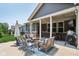 Spacious outdoor living area featuring patio furniture, grilling area, and lighting for evening relaxation at 18998 Beverly Shones Ln, Noblesville, IN 46062