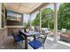 Inviting covered patio with outdoor television, dining and sitting area, perfect for entertaining guests at 18998 Beverly Shones Ln, Noblesville, IN 46062
