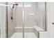 Tiled glass shower with two built-in bench seats, shower head and window at 18998 Beverly Shones Ln, Noblesville, IN 46062