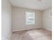 Cozy bedroom featuring natural light from a window, and neutral carpet at 1938 N Dearborn St, Indianapolis, IN 46218