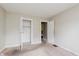 Bedroom with closet and doorway, with neutral paint and carpet at 1938 N Dearborn St, Indianapolis, IN 46218