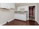 Bright kitchen featuring white cabinets, stylish backsplash, and stainless steel sink at 1938 N Dearborn St, Indianapolis, IN 46218