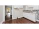 Bright kitchen featuring white cabinets, stylish backsplash, and stainless steel sink at 1938 N Dearborn St, Indianapolis, IN 46218