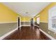 Spacious living room with hardwood flooring and ample natural light flowing in from the windows at 1938 N Dearborn St, Indianapolis, IN 46218