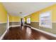 Spacious living room with hardwood flooring and natural light from multiple windows at 1938 N Dearborn St, Indianapolis, IN 46218