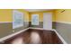 Living room featuring hardwood flooring, natural light, and neutral two-tone paint at 1938 N Dearborn St, Indianapolis, IN 46218