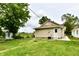 Backyard featuring lush green grass and new landscaping, surrounding this cozy home with a charming outdoor space at 2026 Spruce St, Indianapolis, IN 46203