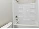 Close up of a modern white shower and bathtub with chrome fixtures at 2026 Spruce St, Indianapolis, IN 46203