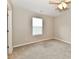 Bedroom with a window, ceiling fan, plush carpet and ensuite access in neutral color scheme at 2026 Spruce St, Indianapolis, IN 46203