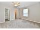 Bedroom with a ceiling fan and a window, with an ensuite bathroom and walk in closet at 2026 Spruce St, Indianapolis, IN 46203