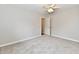 Carpeted bedroom with ceiling fan, neutral paint and an open doorway at 2026 Spruce St, Indianapolis, IN 46203