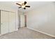 Bedroom with a ceiling fan, a window, and closet space at 2026 Spruce St, Indianapolis, IN 46203