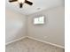 Neutral bedroom with plush carpeting, ceiling fan, and natural light at 2026 Spruce St, Indianapolis, IN 46203