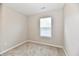Neutral bedroom with plush carpeting and a window for natural light at 2026 Spruce St, Indianapolis, IN 46203