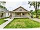 Attractive single-story home featuring a covered front porch, small yard and neat landscaping, enhancing its curb appeal at 2026 Spruce St, Indianapolis, IN 46203