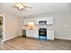 Bright kitchen featuring white cabinets and stainless steel appliances at 2026 Spruce St, Indianapolis, IN 46203