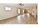 Spacious, open-concept living room with wood-look floors, lots of natural light, and modern fixtures at 2026 Spruce St, Indianapolis, IN 46203