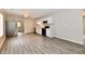Open concept living and kitchen area with wood-look floors, modern fixtures and lots of natural light at 2026 Spruce St, Indianapolis, IN 46203