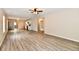 Spacious, open-concept living room with wood-look floors, lots of natural light, and modern fixtures at 2026 Spruce St, Indianapolis, IN 46203
