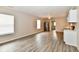 Open concept living and kitchen area with wood-look floors, modern fixtures and lots of natural light at 2026 Spruce St, Indianapolis, IN 46203