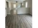 Bright living room showcasing wood-look flooring, neutral walls, and natural light from multiple windows at 2026 Spruce St, Indianapolis, IN 46203