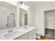 Elegant bathroom featuring dual sinks, quartz countertop, and a separate glass-enclosed shower at 2035 Frost Line Ln, Greenfield, IN 46140
